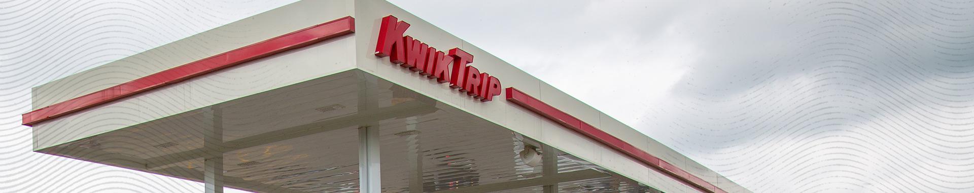 Panoramic color closeup photo of the protective, freestanding awning/cover located above Kwik Trip gas pumps