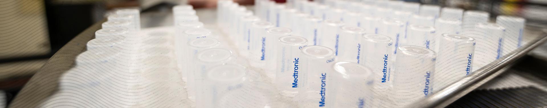 AMS Micromedical product closeup of clear-plastic, bottle-style Medtronic technology